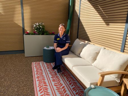 Laura in outside area of Swan Suite.jpeg