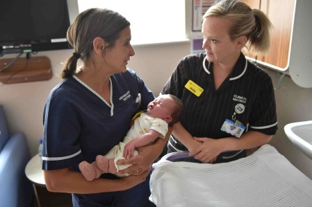 Two midwives and baby