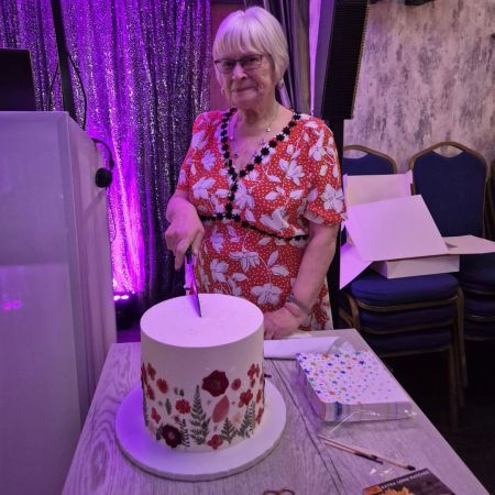 Joan cutting cake.jpg